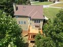Spacious wooden deck overlooks the backyard and surrounding trees at 5737 Russell Ct, Douglasville, GA 30135