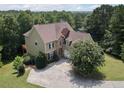 Charming two-story home featuring stone accents and mature landscaping at 5737 Russell Ct, Douglasville, GA 30135
