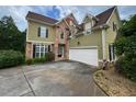 Spacious home with a two-car garage, stone accents, and a well-maintained front yard at 5737 Russell Ct, Douglasville, GA 30135