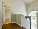 Bright upstairs landing with hardwood floors, natural light, and views to the entryway at 20 Old Oak Ct, Covington, GA 30016