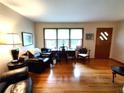 Bright living room with hardwood floors, desk area, and natural light at 3556 Forest Hill Rd, Powder Springs, GA 30127