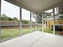 Enjoy outdoor living in this screened porch with views of the backyard and privacy fence at 1227 Fern Ridge Ct # 17, Norcross, GA 30093