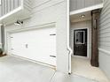 A two-car garage and covered entryway give easy access to this well-kept home at 1237 Fern Ridge Ct # 18, Norcross, GA 30093