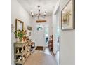 Well-decorated entryway with a console table, decorative mirror, and stylish lighting, offering a warm welcome at 173 Bramlett Ridge Dr, Dallas, GA 30157