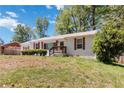 View of the home's exterior, showcasing its neat landscaping and classic design at 1907 Clarke Ln, Decatur, GA 30035