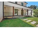 Charming front porch with stone walkway, wooden posts, and wrought iron railing at 819 Loridans Ne Dr, Atlanta, GA 30342