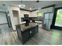 Modern kitchen with stainless steel appliances, granite countertops, and updated lighting at 185 Glenrose Sw Cir, Atlanta, GA 30354