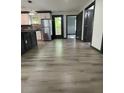 Modern updated kitchen with stainless appliances and access to backyard deck at 185 Glenrose Sw Cir, Atlanta, GA 30354