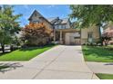 Stunning two-story home with manicured lawn and a porte cochere provides elegant curb appeal at 326 Carmichael Cir, Canton, GA 30115