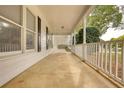 Relaxing covered front porch with swing, perfect for enjoying the outdoors at 70 Summer Walk Dr, Covington, GA 30016