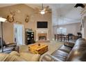 Cozy living room features vaulted ceilings, brick fireplace and open to dining area at 70 Summer Walk Dr, Covington, GA 30016