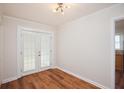 Bright dining room with wood floors and double glass doors at 2179 Jernigan Drive Se Dr, Atlanta, GA 30315