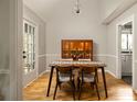 Cozy dining area with hardwood floors, modern furniture, and natural light at 4727 Emily Sw Dr, Lilburn, GA 30047