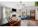 Bright living room with a fireplace, large windows, and comfortable seating at 1809 Cassville Nw Rd, Cartersville, GA 30121