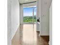 Bright living room features hardwood floors and a large window with scenic views at 361 17Th Nw St # 1708, Atlanta, GA 30363