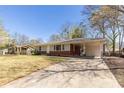Well-maintained single-Gathering home with a driveway and a carport at 43 Lott Se Ave, Marietta, GA 30067