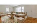 Bright living room with large windows and hardwood floors, furnished with stylish decor at 43 Lott Se Ave, Marietta, GA 30067