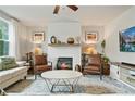 Inviting living room featuring a cozy fireplace, comfortable seating, and stylish decor at 13 Oakside Nw Ct, Cartersville, GA 30121