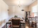 Elegant dining room featuring a large wooden table, stylish chairs, and a decorative chandelier at 375 Madison Grace Ave, Mcdonough, GA 30252