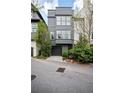 Modern townhome with a striking gray exterior, clean lines, and an attached garage at 588 Bismark Ne Rd, Atlanta, GA 30324
