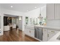 Bright, eat-in kitchen with farmhouse sink, marble countertops and stainless appliances at 1050 Willeo Ct, Marietta, GA 30068