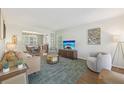 Bright living room featuring hardwood floors, neutral walls, and a seamless flow to the adjacent dining area at 2789 Townley Cir, Atlanta, GA 30340