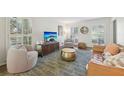 Cozy living room with large windows, hardwood floors, plush seating, and stylish decor creating a welcoming atmosphere at 2789 Townley Cir, Atlanta, GA 30340