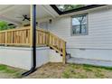View of the front porch, showcasing natural wood details and exterior features at 538 Center Hill Nw Ave, Atlanta, GA 30318