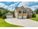 Beautiful brick home with a three car garage and extra parking space at 981 Golden Meadows Ln, Loganville, GA 30052