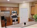 Well-equipped kitchen features stainless steel appliances and wood cabinetry at 1910 Cedar Glenn Way # 4104, Atlanta, GA 30339