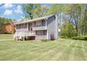 Charming home with a well-maintained lawn, featuring a cozy front porch and attached garage at 3560 Riverchase Dr, Decatur, GA 30034