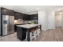 Modern kitchen with island and stainless steel appliances at 2857 Regal Park # 3, Atlanta, GA 30318