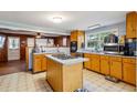 Traditional kitchen features an island cooktop, lots of cabinets and a bright eating area at 3024 Bob Cox Rd, Marietta, GA 30064