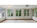 Bright sunroom with many windows, offering a peaceful space to relax and enjoy views at 3024 Bob Cox Rd, Marietta, GA 30064