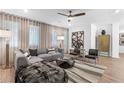 Inviting living room with a comfortable gray sofa, artistic decor, and large windows for ample natural light at 371 Grant Se Cir # 1822, Atlanta, GA 30315