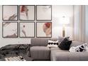 Comfortable living room with a plush gray sectional, accent pillows, a stylish lamp, and modern artwork at 371 Grant Se Cir # 1822, Atlanta, GA 30315