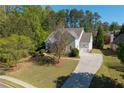 Aerial shot of the home showcasing its spacious lot and three-car garage at 1438 Sutters Pond Nw Dr, Kennesaw, GA 30152