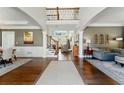 Spacious foyer featuring hardwood floors, a grand staircase, and elegant decor at 317 Vista Lake Dr, Suwanee, GA 30024