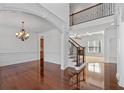 Bright and spacious foyer with hardwood floors, elegant staircase and chandelier creates a grand entrance at 2365 Barrington Trace Sw Cir, Atlanta, GA 30331