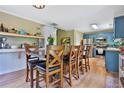 Inviting dining area with wood floors, a large table with seating for six, and modern lighting at 2675 Dacula Ridge Dr, Dacula, GA 30019