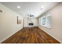 Bright living room with hardwood floors, sleek fireplace, built-in shelving, and plenty of natural light at 754 Pinehill Se Dr, Smyrna, GA 30080