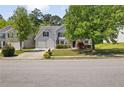 Charming home with two-car garage, well-kept lawn, and mature shade trees at 3571 Oakshire Se Way, Atlanta, GA 30354