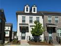 Beautiful brick and painted brick townhome with dormer windows at 1329 Bennett Creek Ovlk, Suwanee, GA 30024