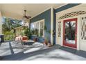 Inviting front porch with seating, plants, and a stylish red front door, creating a perfect spot for relaxation at 462 N Highland Ave, Atlanta, GA 30307