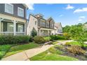 Beautiful home with a well-manicured lawn and landscaping, providing great curb appeal at 52 Lath House Ln, Marietta, GA 30066