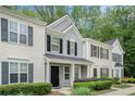 Attractive townhome featuring multiple windows, tidy landscaping, and a well-kept facade at 1728 Devon Sw Dr, Atlanta, GA 30311