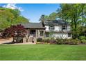 Charming two-story home with a well-manicured lawn and inviting front entrance at 2750 Interlaken Dr, Marietta, GA 30062