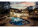 Beautiful backyard with a sparkling blue pool and ample patio space for entertaining at 2750 Interlaken Dr, Marietta, GA 30062