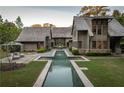 Backyard showcasing a pool, patio, and lush greenery, creating a serene and inviting outdoor space at 2979 Ridgewood Nw Rd, Atlanta, GA 30327