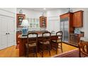 Gourmet kitchen with wood cabinets, stainless steel appliances, granite countertops, and a large island with seating at 4470 Crestwicke Pointe, Atlanta, GA 30319